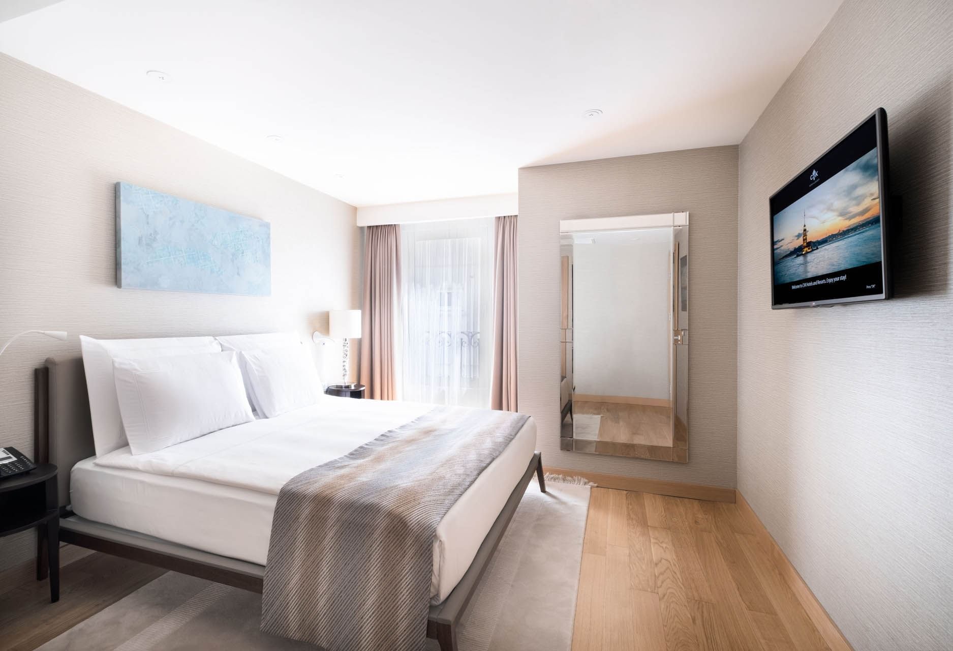 Two massage beds with a tray of amenities in Safira Spa & Fitness at CVK Park Prestige Suites Istanbul