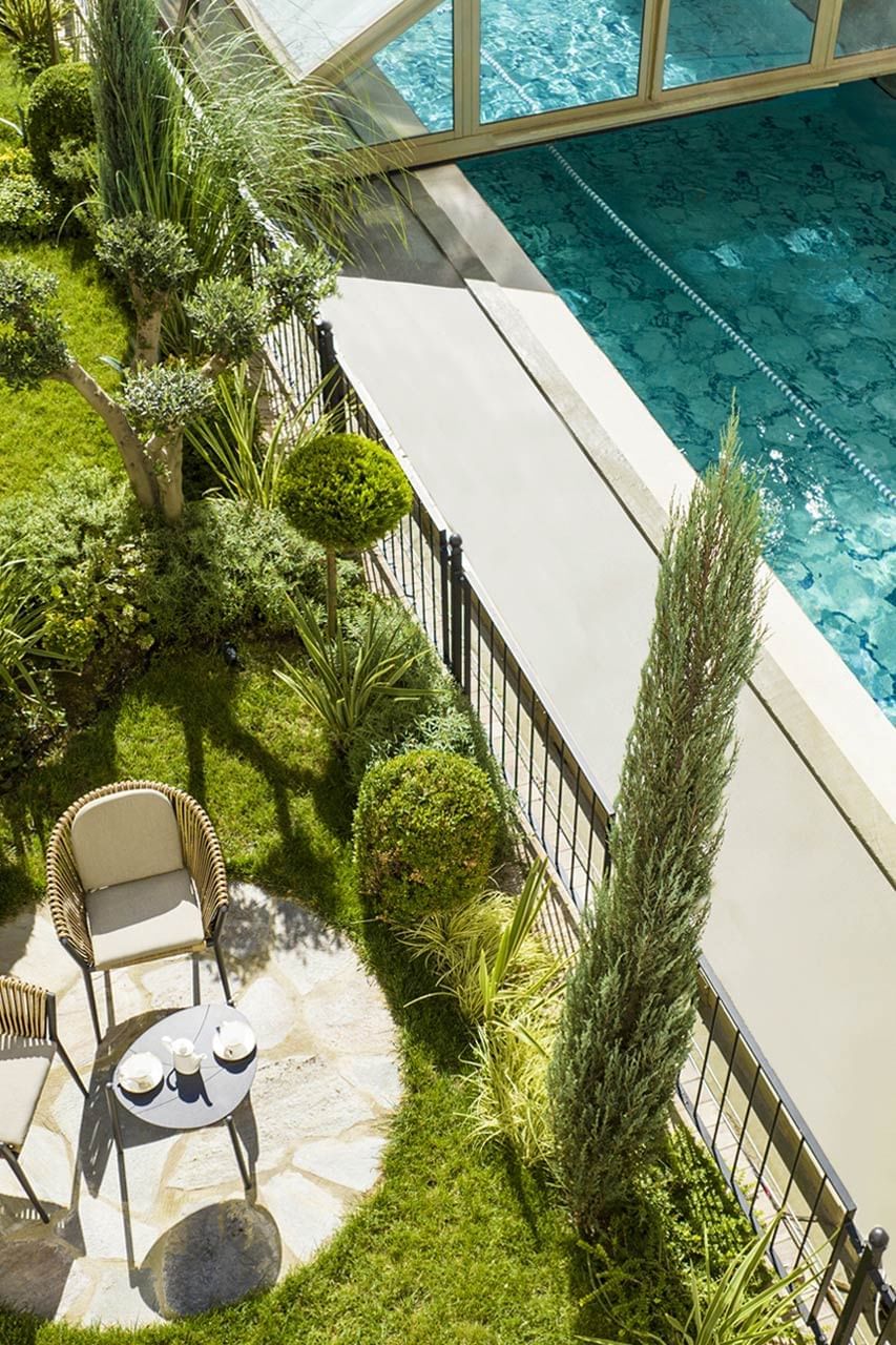 Aerial view of the outdoor dining area and swimming pool at CVK Hotels